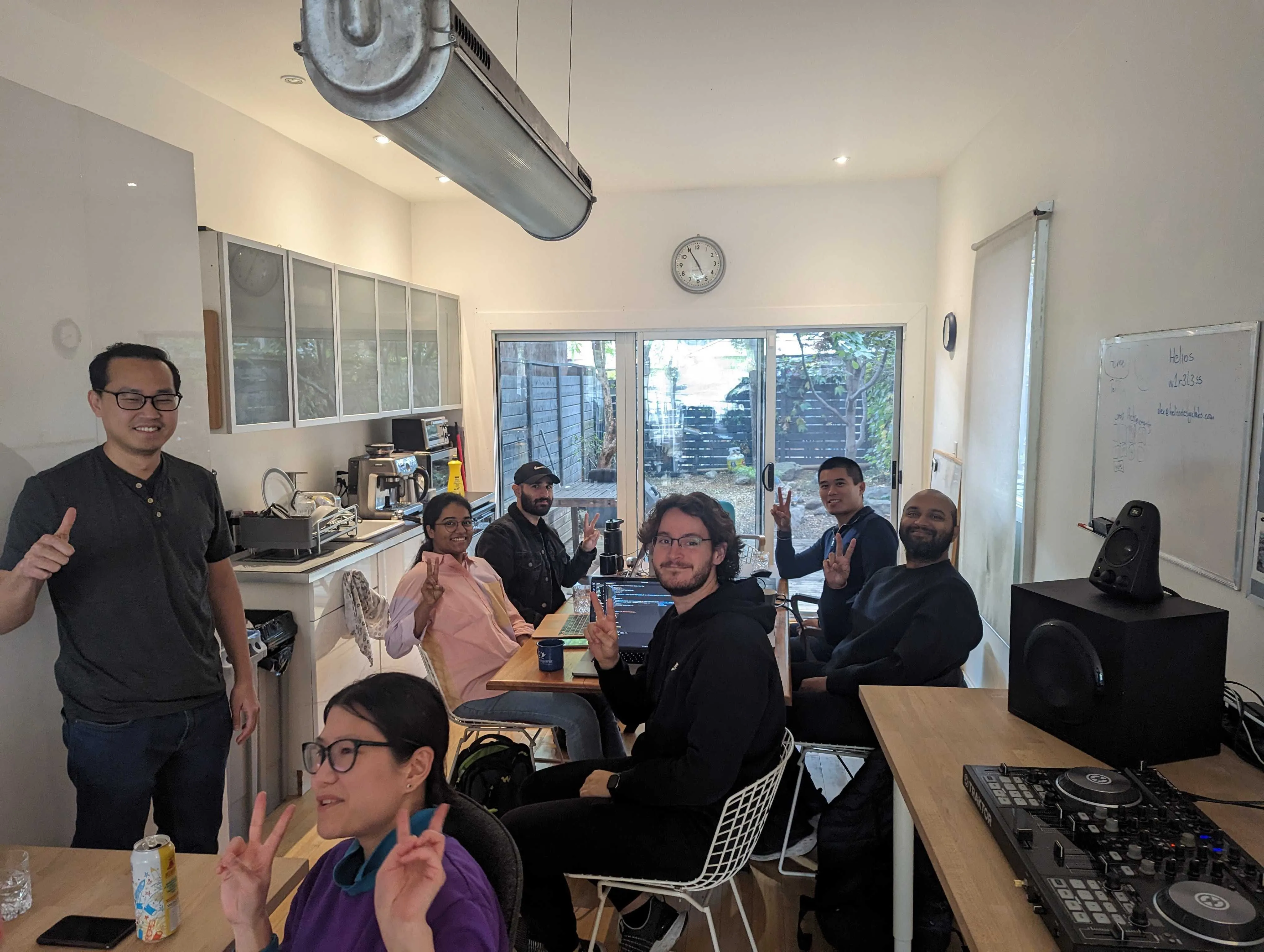 A picture of a group of people smiling to the photo