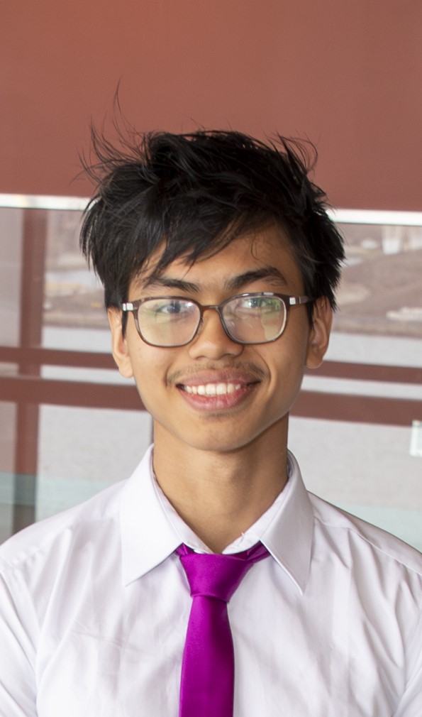 Zin, wearing glasses, in a white shirt with a purple tie. A typical corporate headshot lol.